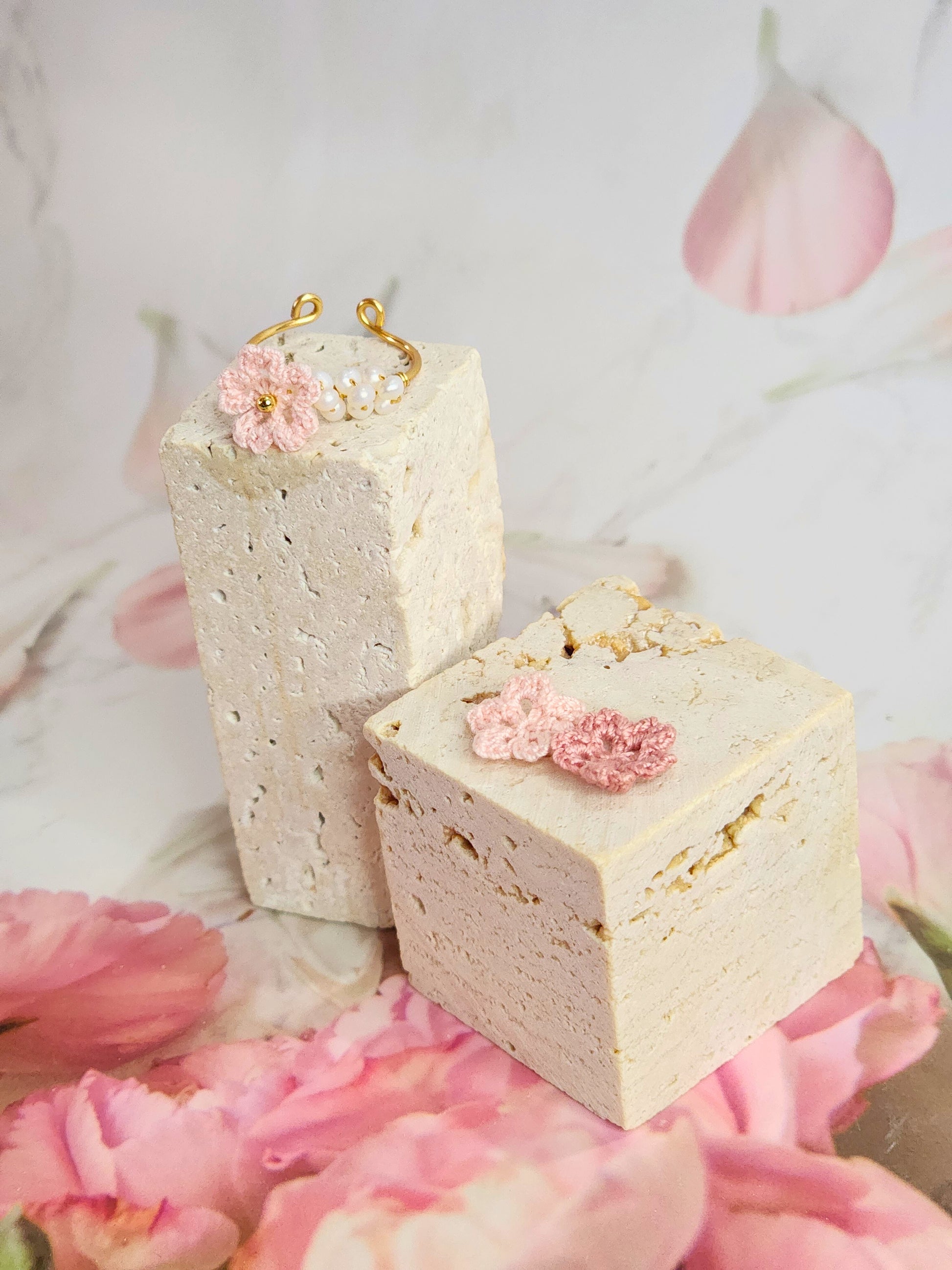 Band of natural freshwater pearls ring adorned with a delicately handcrafted micro‑crochet Sakura. 18K gold-plated adjustable ring.