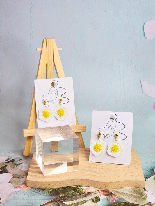 Pair of cute & whimiscal fried egg micro-crochet earrings. Handcrafted with ultra-fine lace yarn and paired with sterling silver hooks