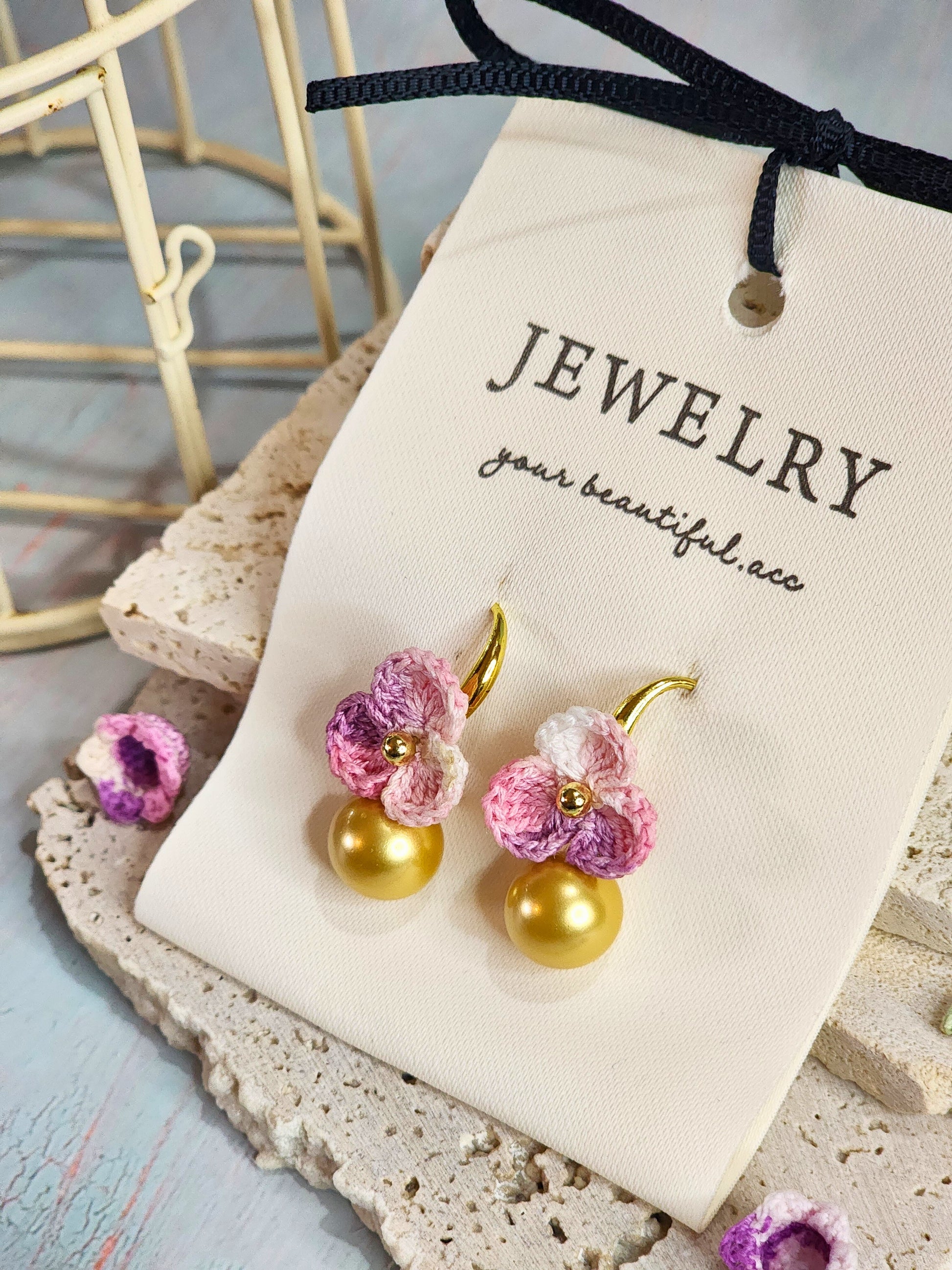 Luxurious dark gold South Sea pearl earrings with handcrafted micro‑crochet florets on 18K gold-plated ear hooks close-up
