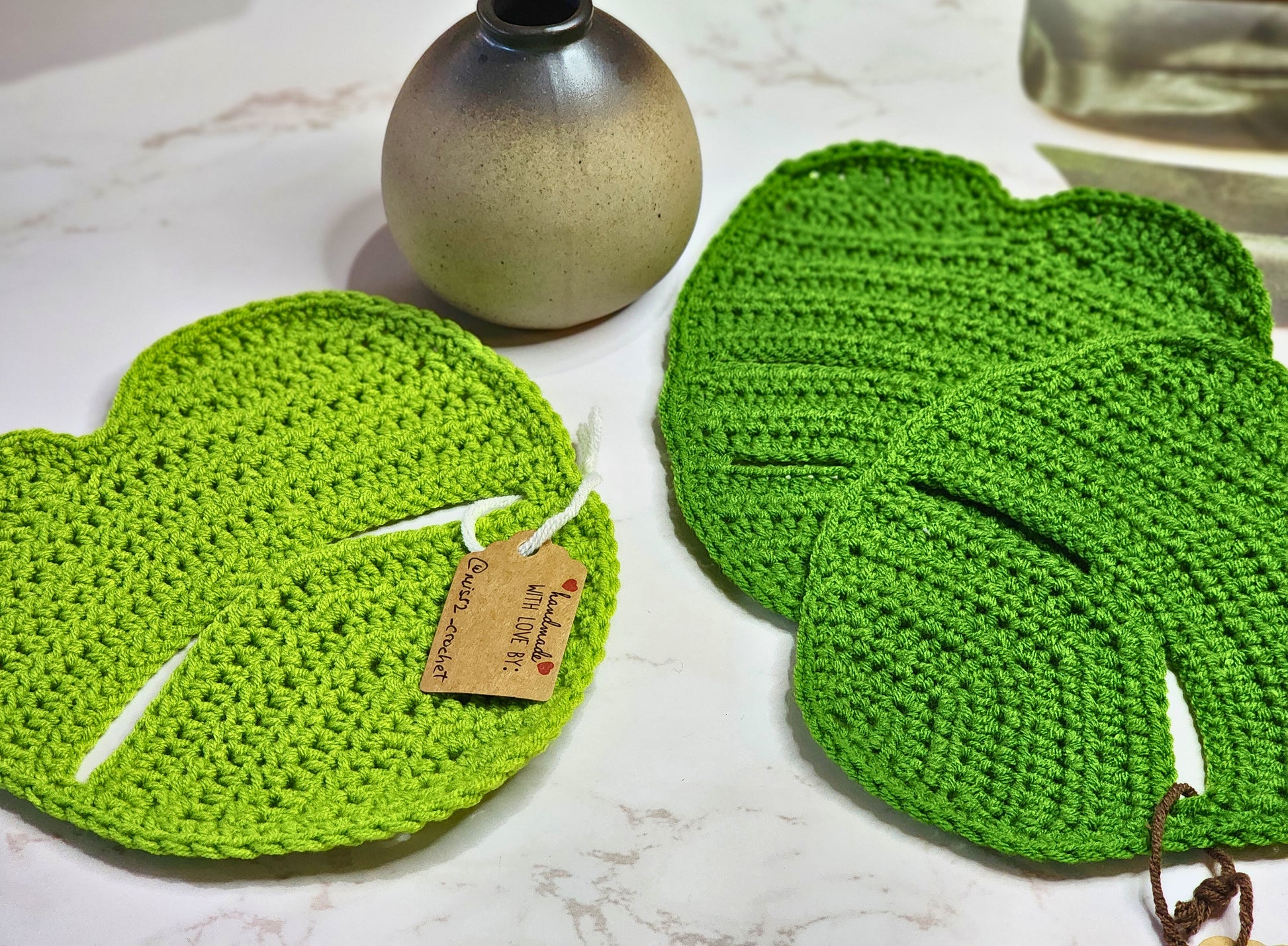 Monstera crocheted table decor pieces in two shades of green