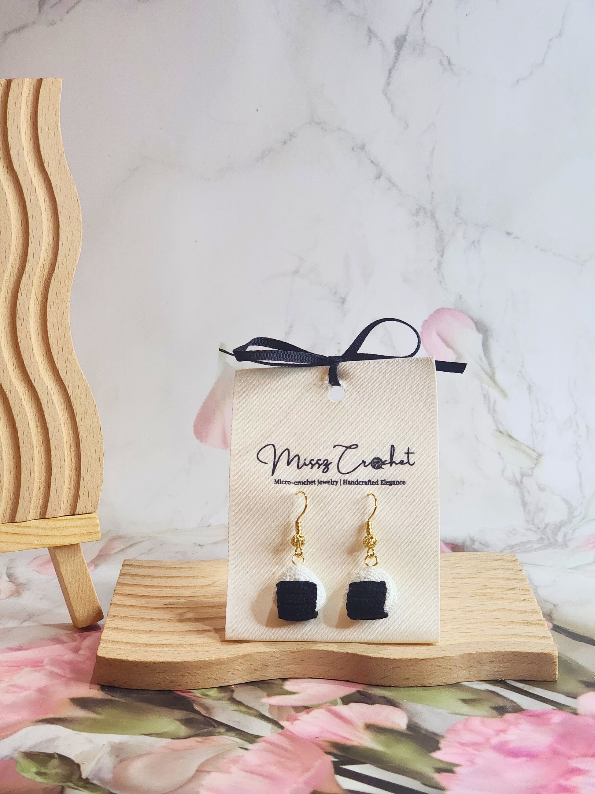 Handcrafted kawaii micro-crochet onigiri earrings on 18K gold-plated ear hooks