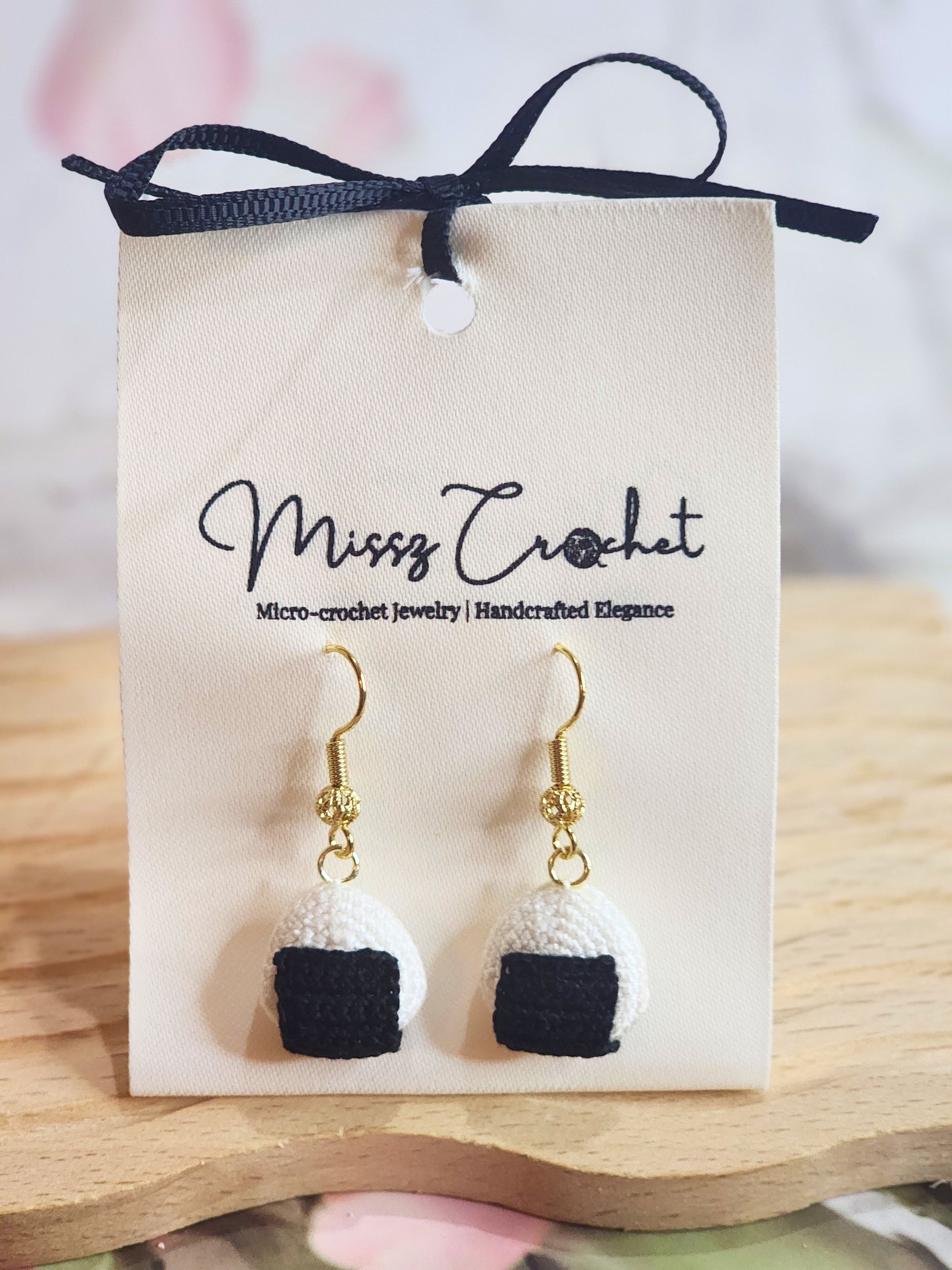 Handcrafted kawaii micro-crochet onigiri earrings on 18K gold-plated ear hooks