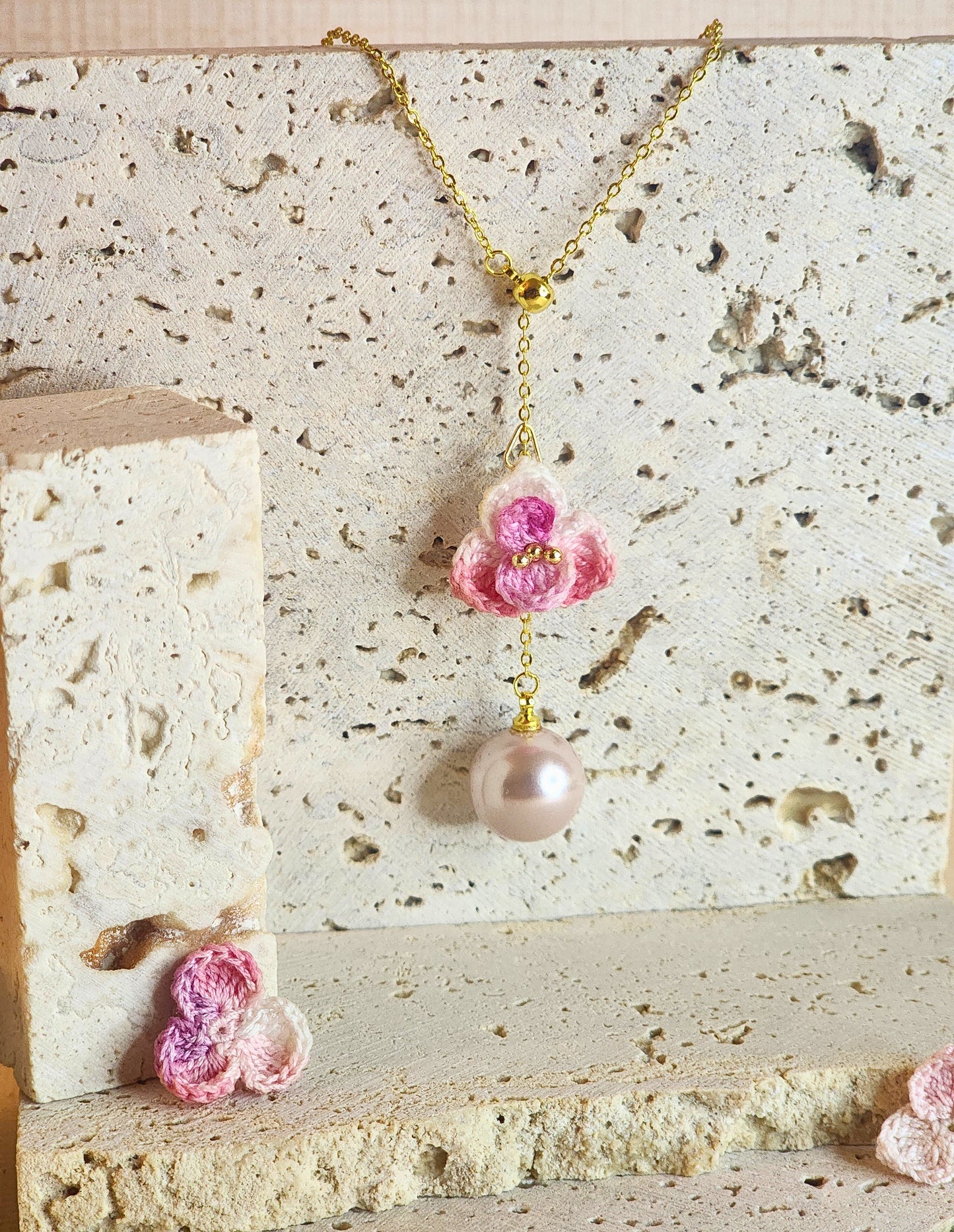 Close up of a Pink-White Orchid mIcro-crochet necklace with 12mm pink-purple Aurora grade natural freshwater pearl