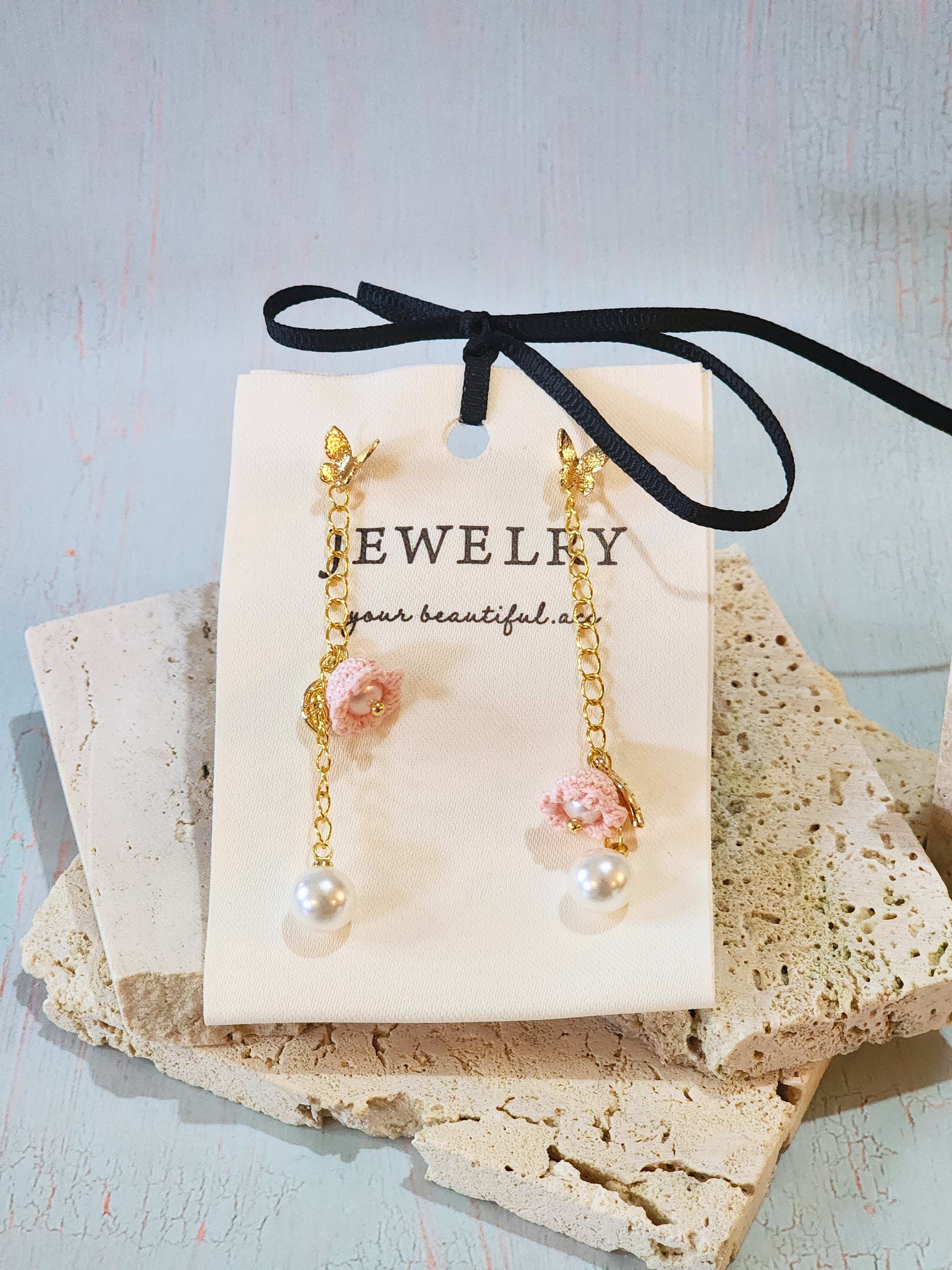 Luminous Australian White Sea Pearls with handcrafted micro-crochet Pink Lily of the Valley on 18K gold-plated chain and studs close up