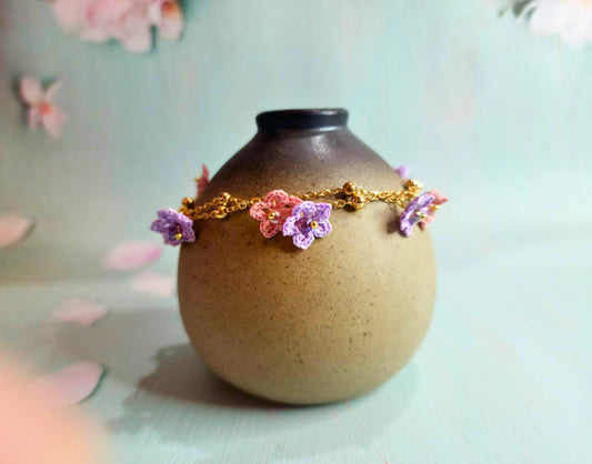 Pink & purple micro-crochet star flowers accented with Miyuki glass beads on double strand 18K gold-plated bracelet