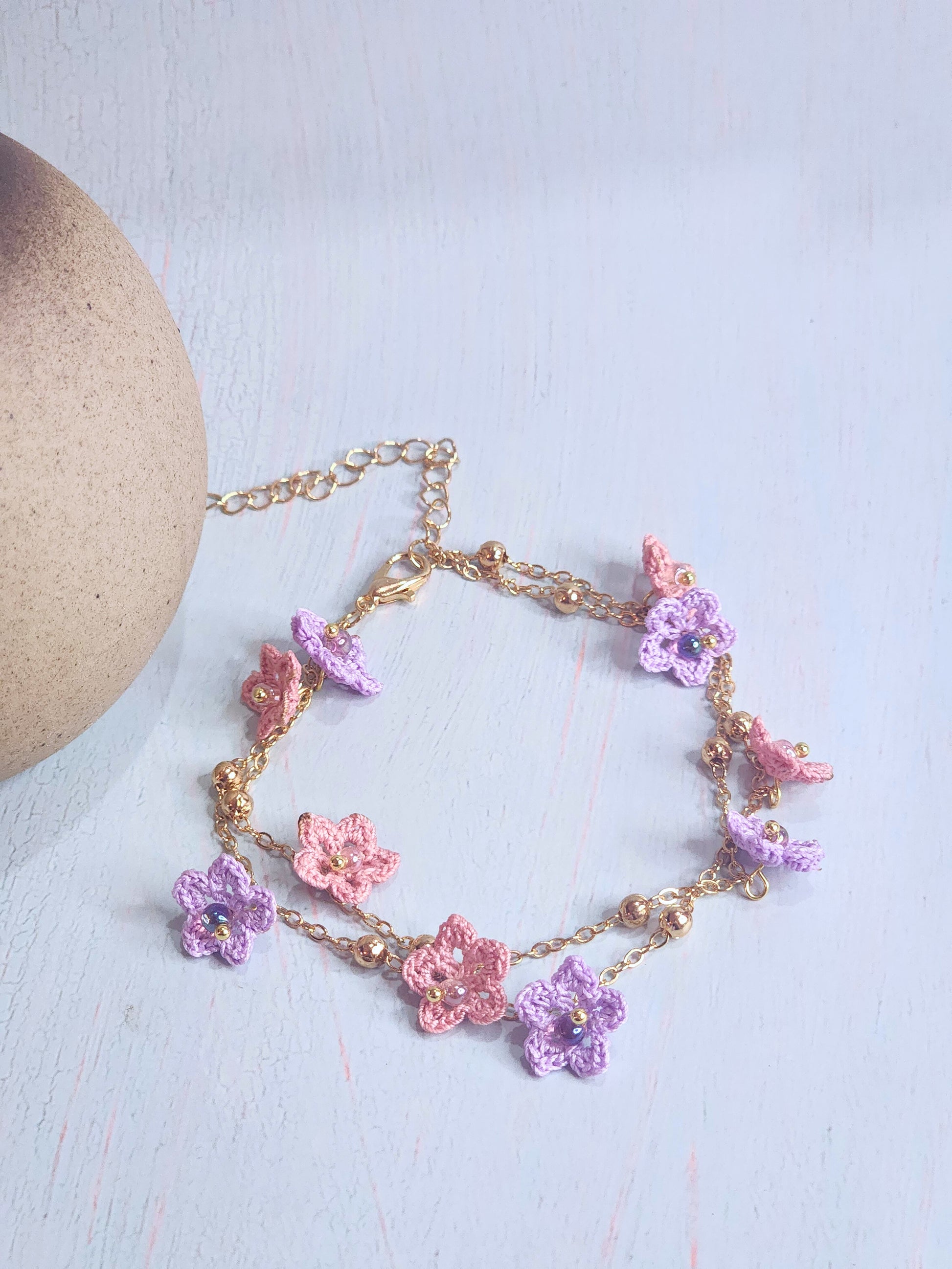 Pink & purple micro-crochet star flowers accented with Miyuki glass beads on double strand 18K gold-plated bracelet