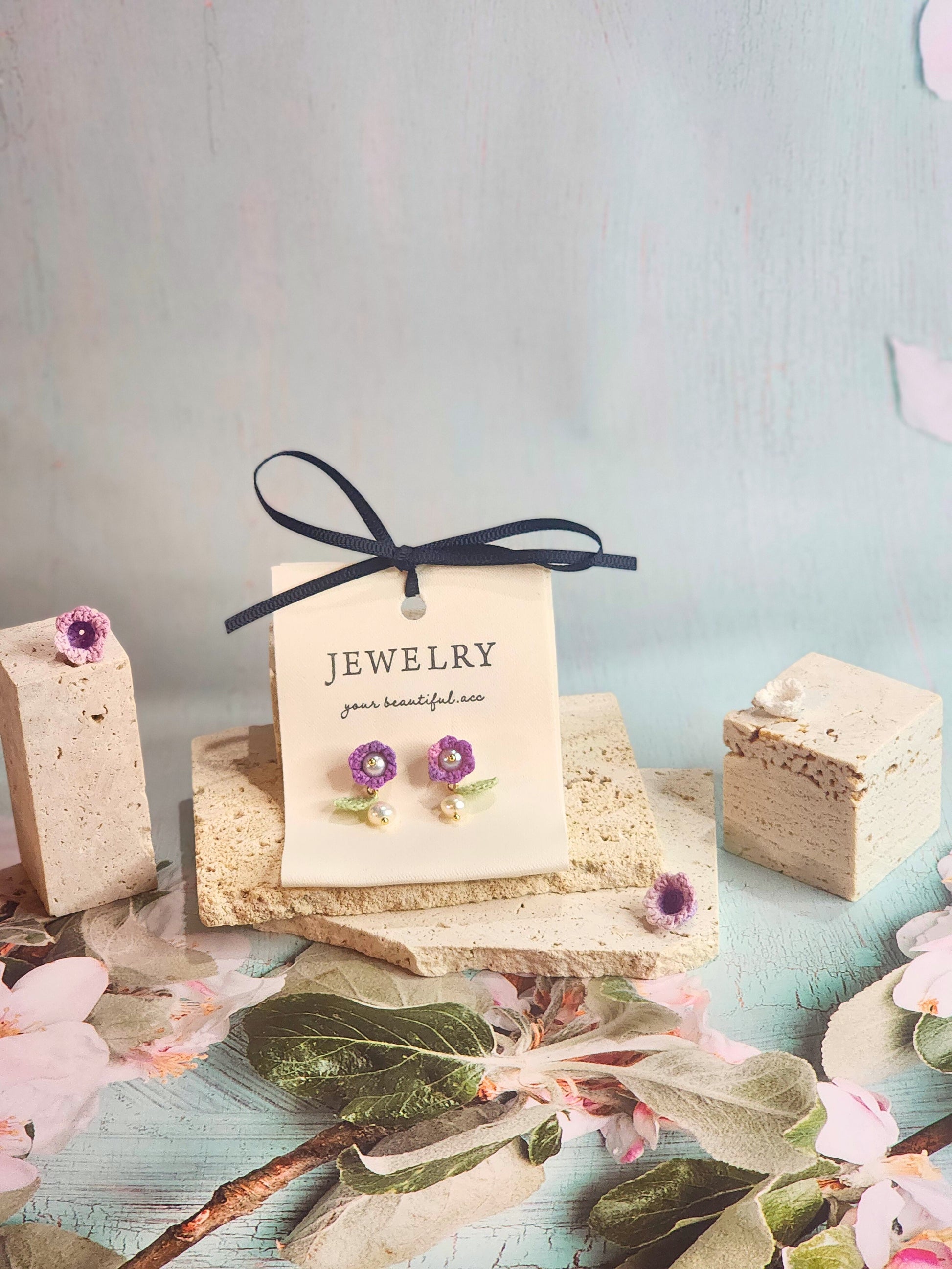 Handcrafted purple micro-crochet Lily of the Valley earrings, adorned witb 5-5.5mm freshwater pearls and 5-6mm Baroque pearls. 18K gold-plated studs.