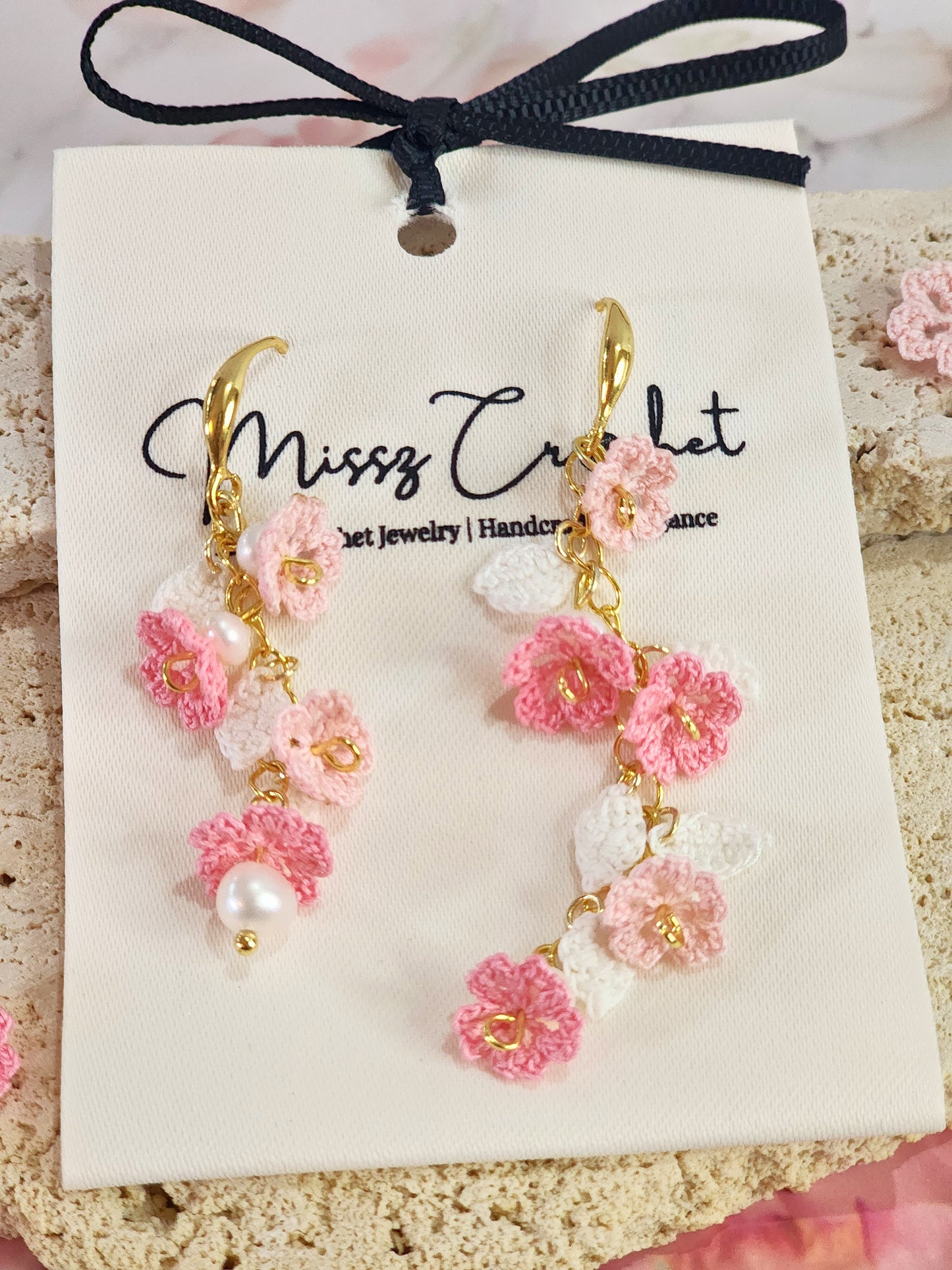 Handcrafted asymmetrical chandelier earrings featuring multiple tiers of micro-crochet Sakura and natural 4-5mm Baroque pearls