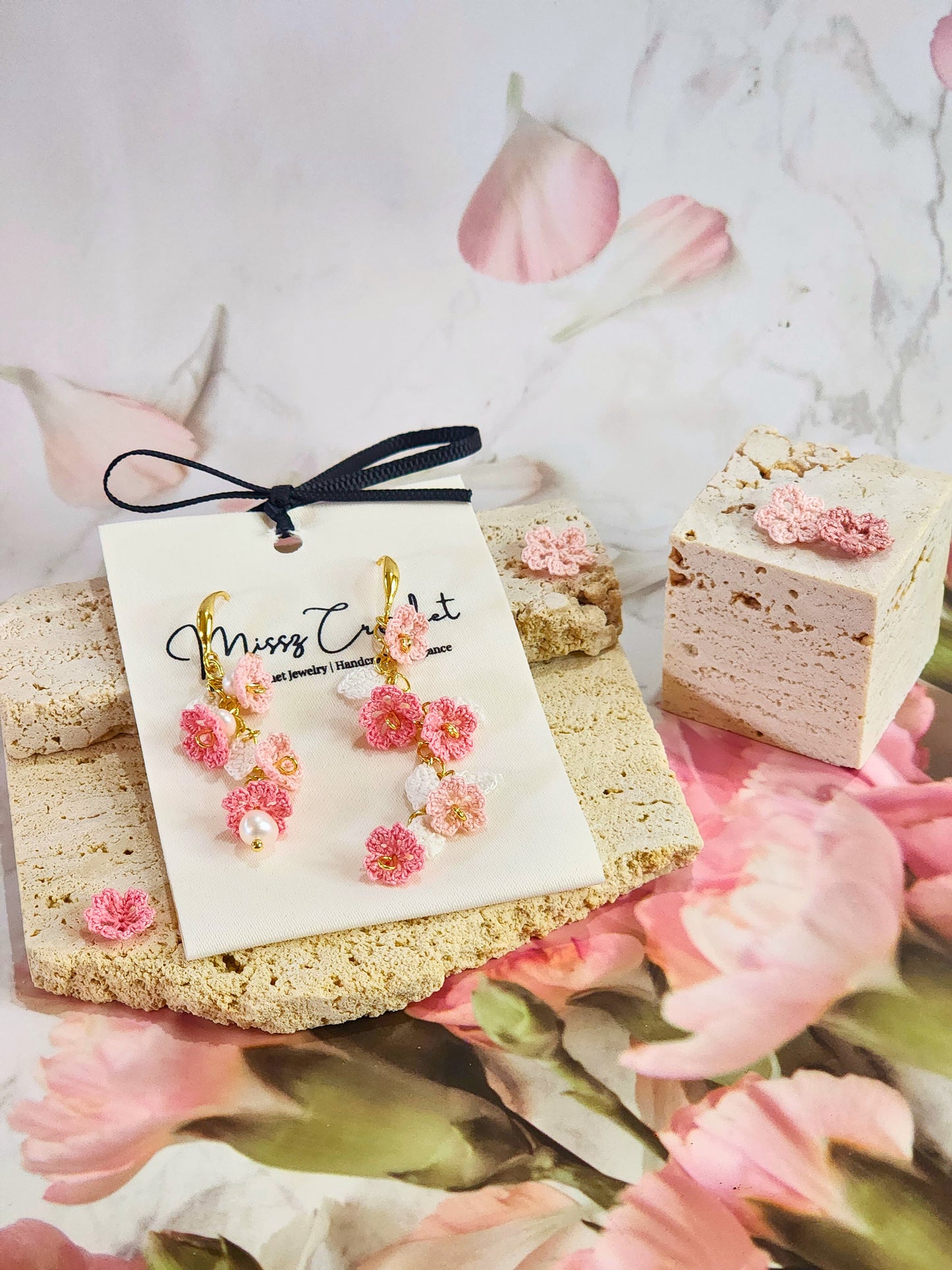 Handcrafted asymmetrical chandelier earrings featuring multiple tiers of micro-crochet Sakura and natural 4-5mm Baroque pearls