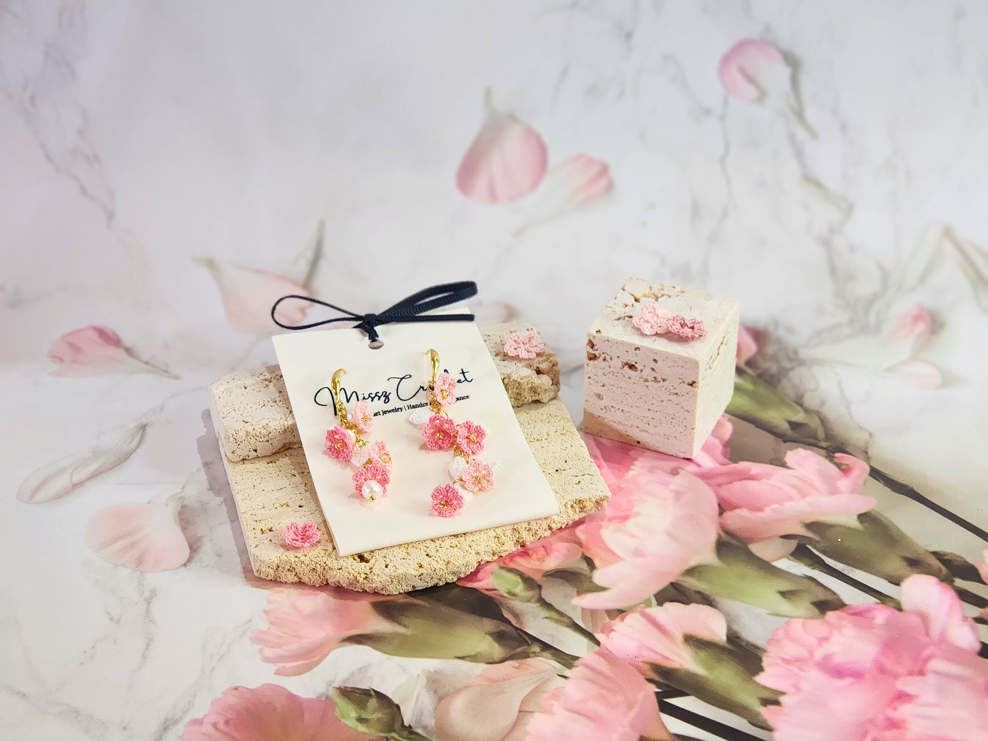 Handcrafted asymmetrical chandelier earrings featuring multiple tiers of micro-crochet Sakura and natural 4-5mm Baroque pearls