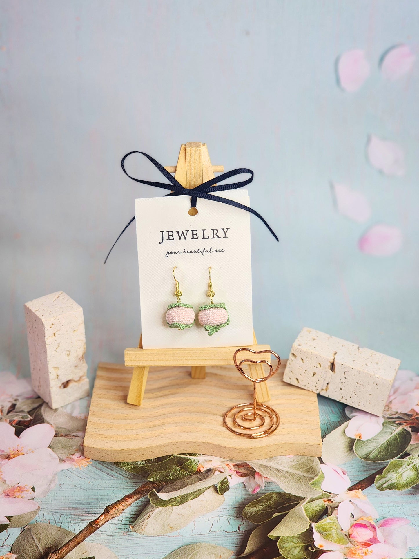 A pair of sweet Sakura mochi micro-crochet earrings handcrafted with ultra-fine lace yarn and 18K gold-plated hooks