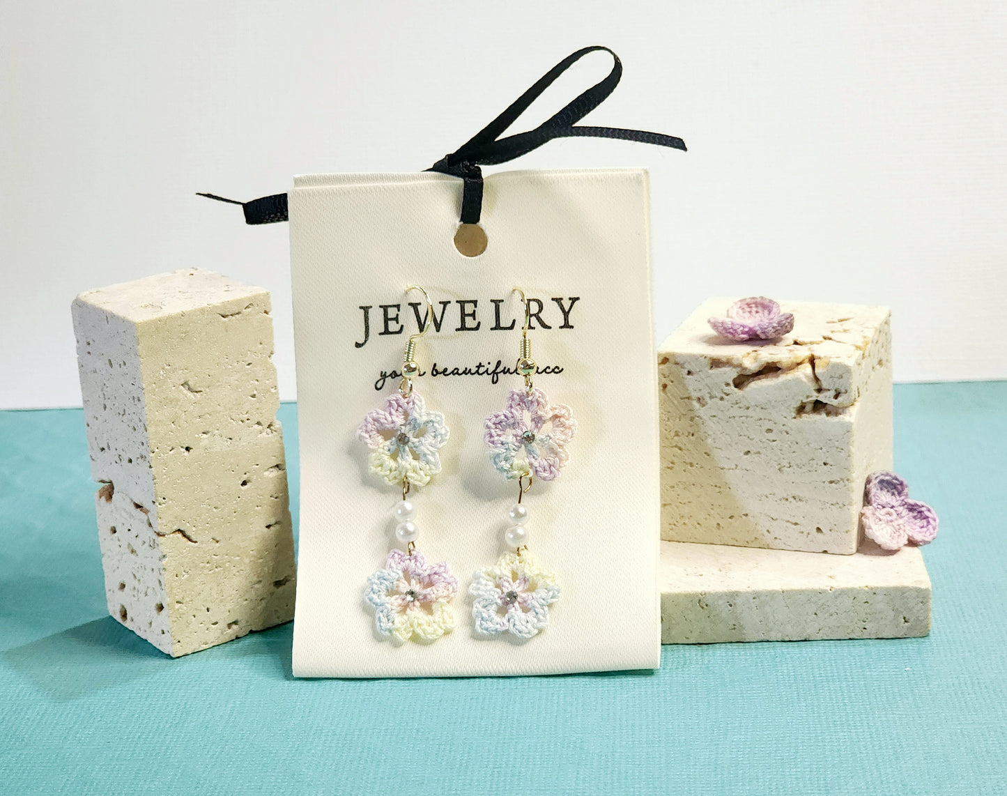 A pair of luxury micro-crochet Sakura chandelier earrings in light color