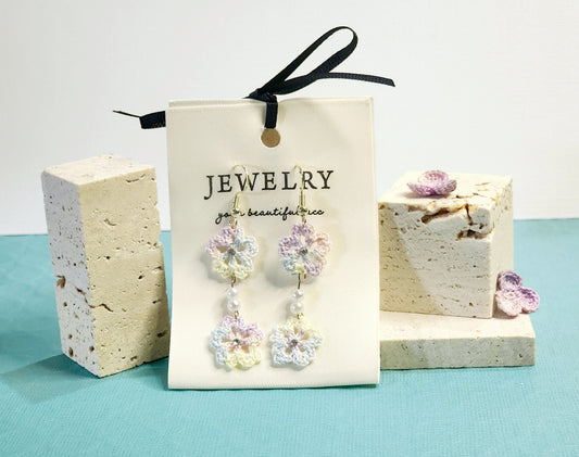 A pair of luxury micro-crochet Sakura chandelier earrings in light color