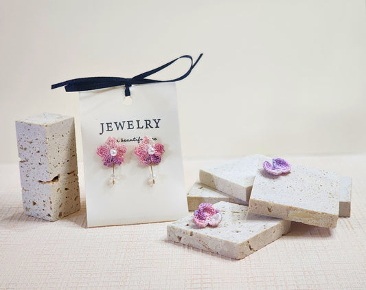 A pair of Sakura with Pearls & Crystals Micro-crochet Earrings