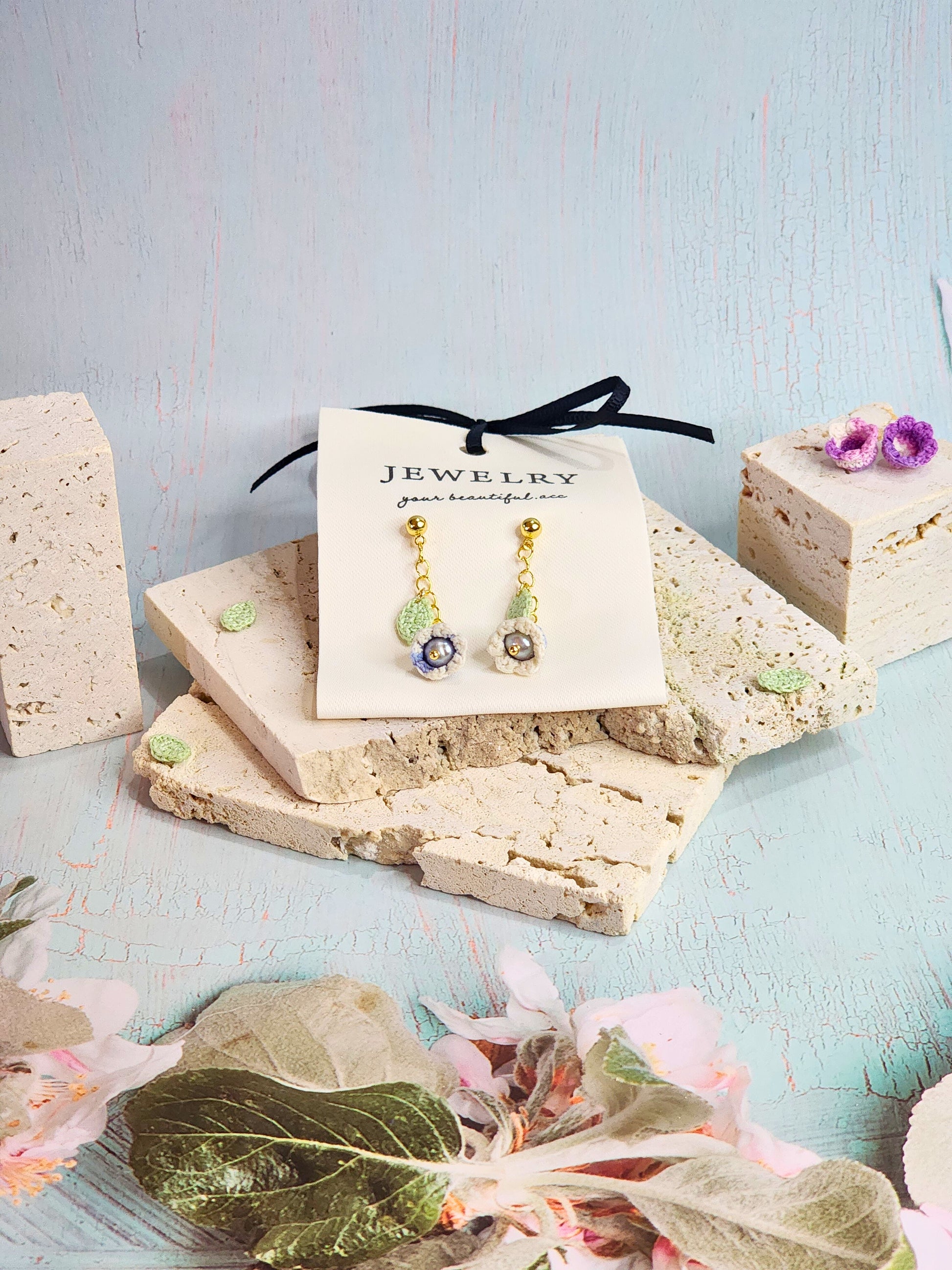 Collection of handcrafted White-blue micro-crochet Lily of the Valley dangle and chandelier earrings. 18K gold-plated studs and chains.