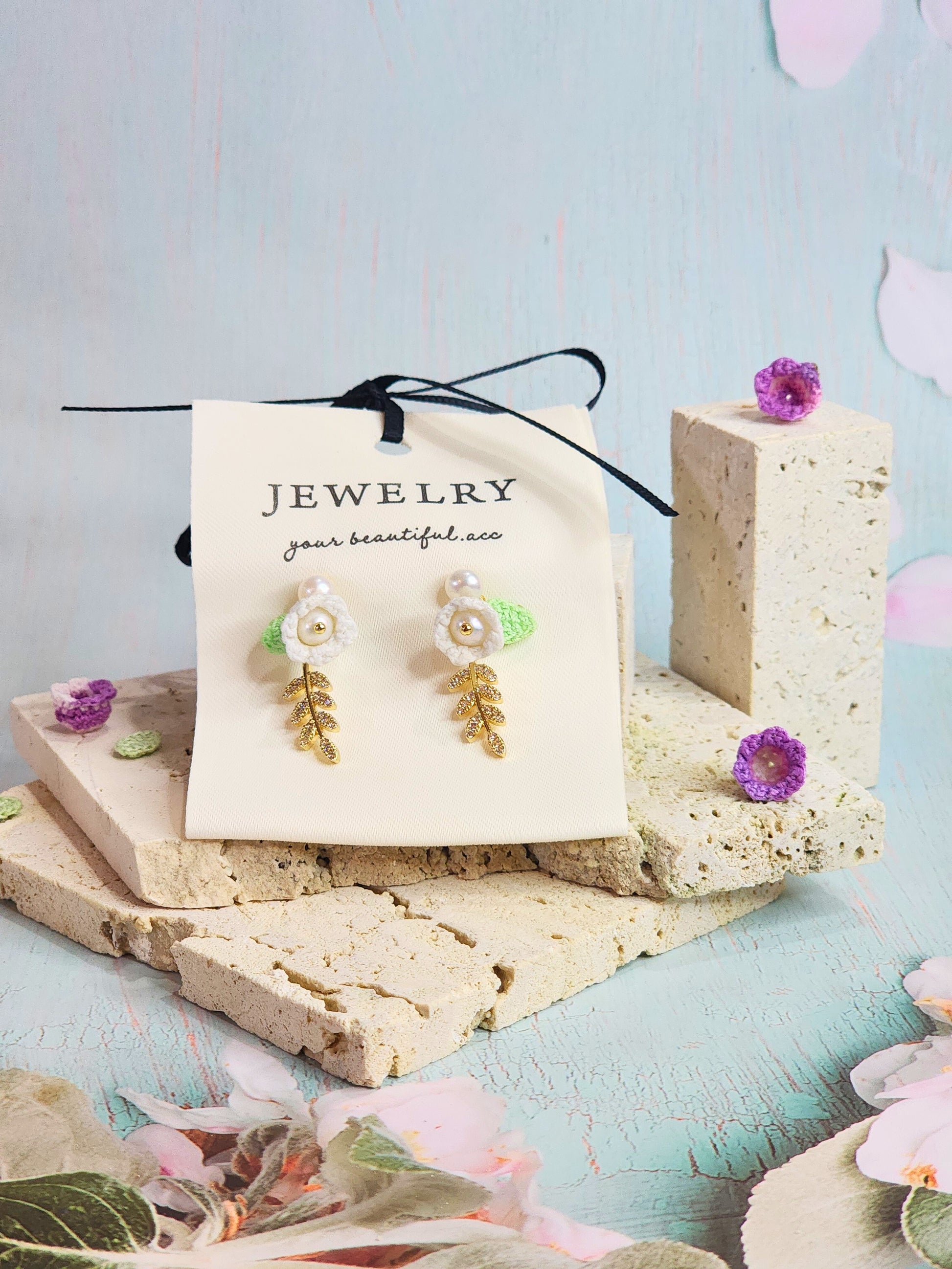 Handcrafted white micro-crochet Lily of the Valley with 4.5-5mm freshwater pearls earrings. 18K gold-plated enamel & zircon leaves.