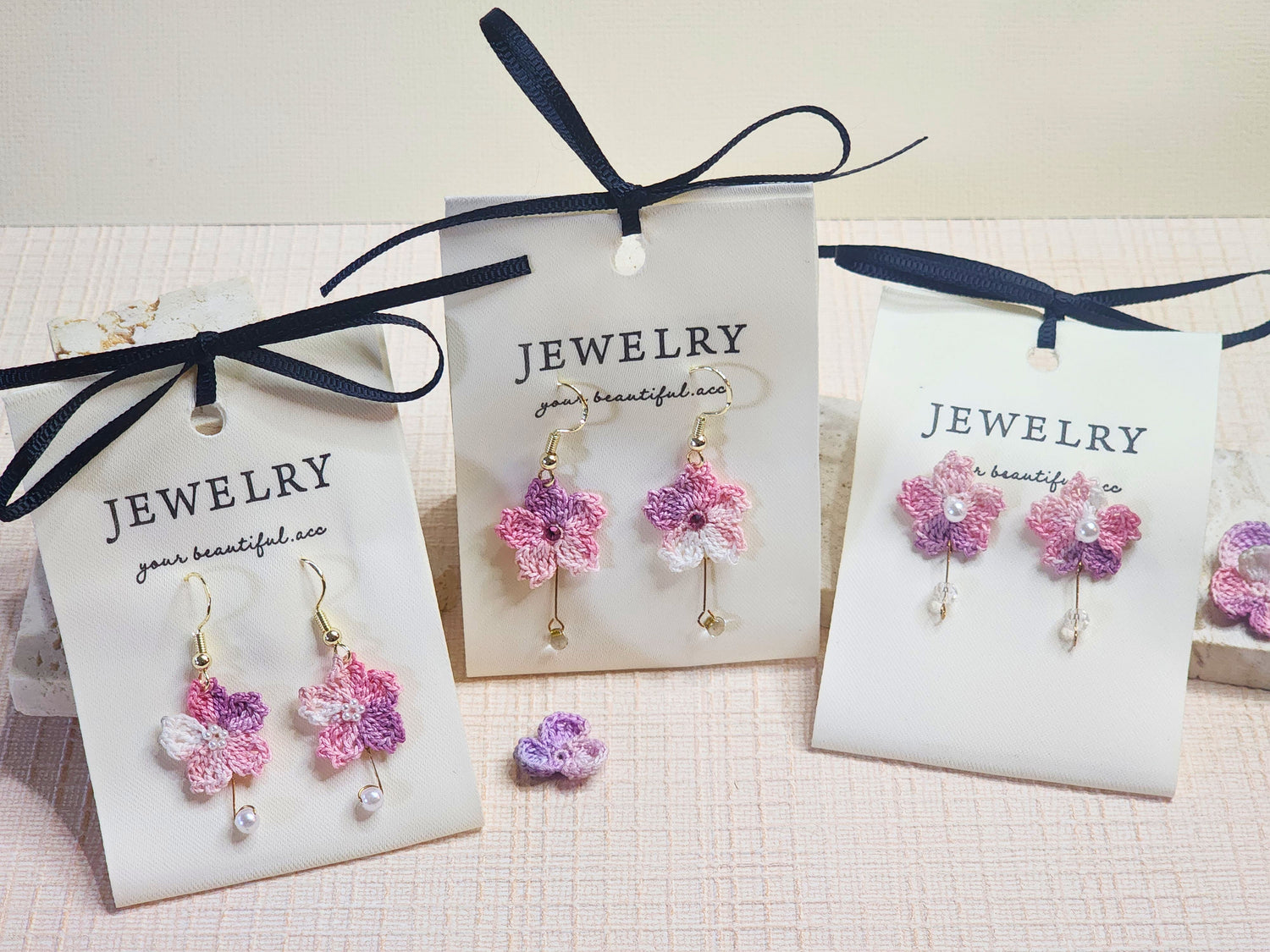 A collection of pink Sakura micro-crochet drop earrings with quality pearl beads and crystals