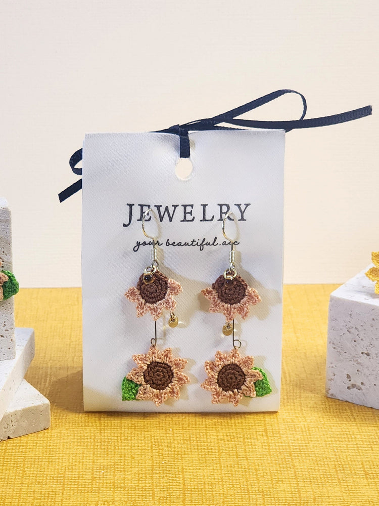 A pair of unique limited sunflower micro-crochet dangle earrings