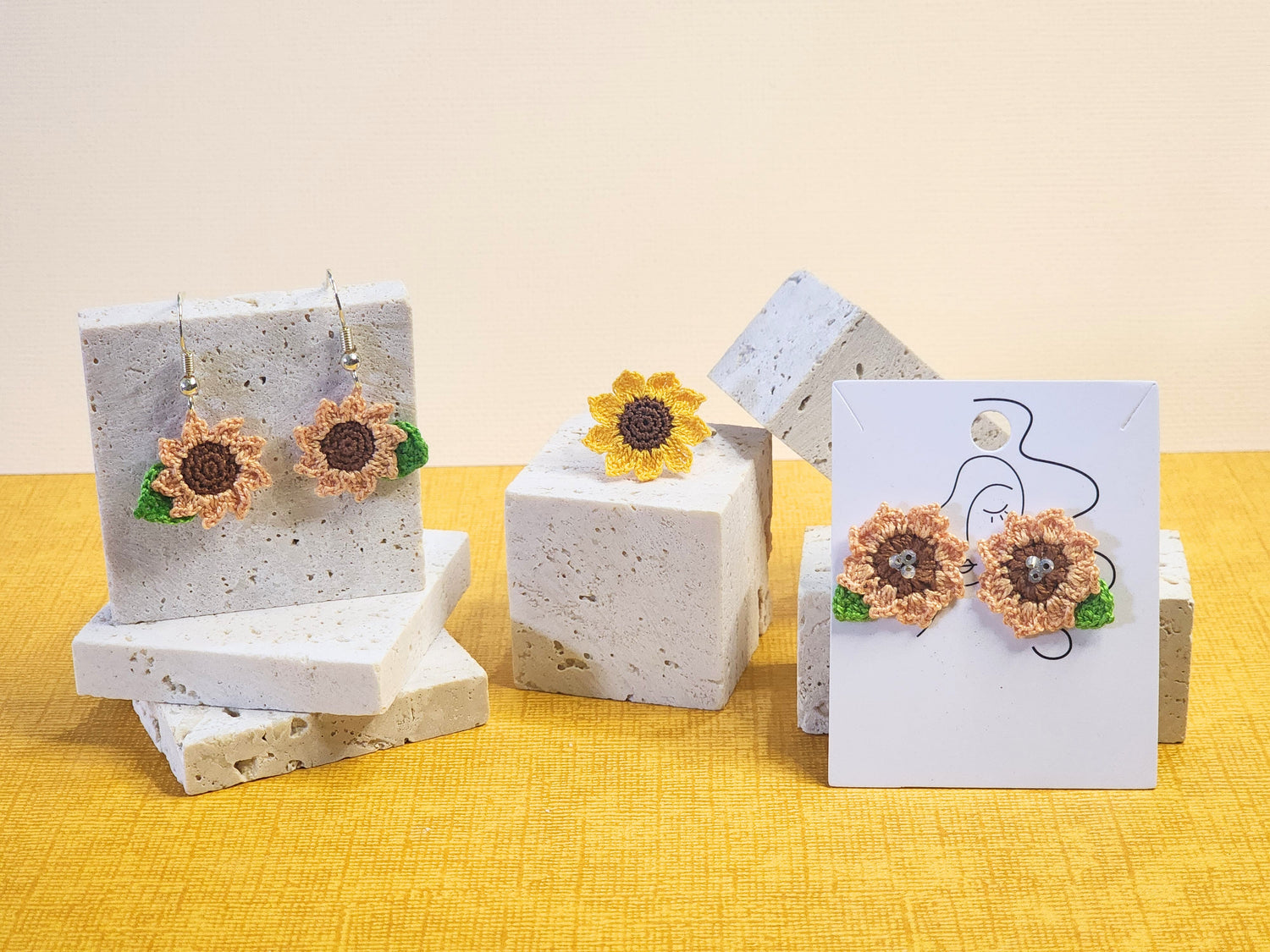 A collection of bright sunny sunflower micro-crochet earrings & ring 