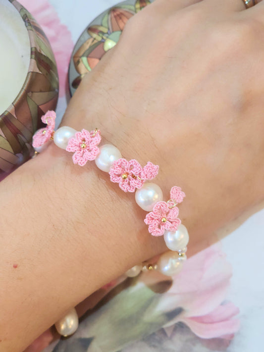 Natural 8-9mm Baroque Pearls with pink micro-crochet Sakura blossoms. Set with 18K gold-plated extension chain.