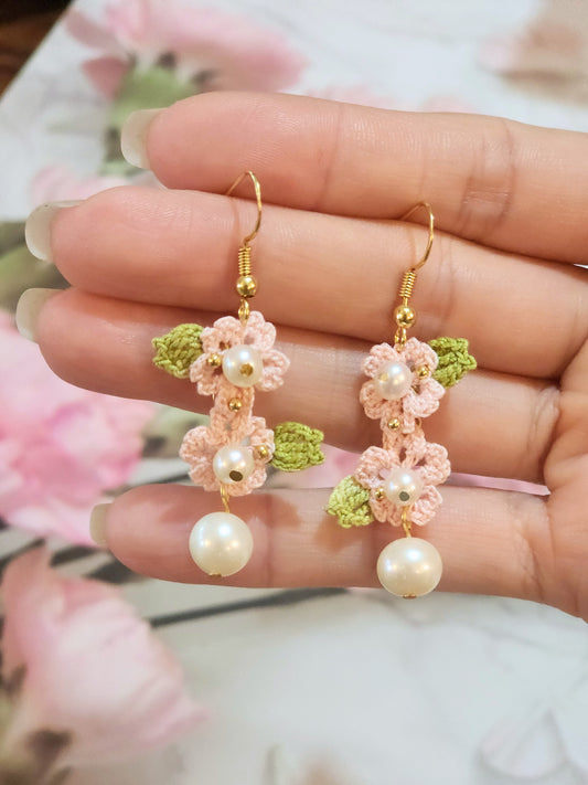 Handcrafted light pink sakura blossoms with natural freshwater pearls & 18K gold-plated hooks 