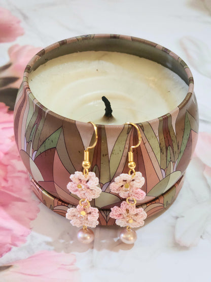Handcrafted micro-crochet Sakura blossoms paired with lustrous, pink 6-7mm natural freshwater pearls and Miyuki waterdrop glass beads from Japan. 