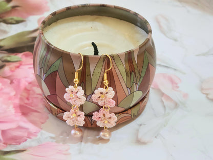Handcrafted micro-crochet Sakura blossoms paired with lustrous, pink 6-7mm natural freshwater pearls and Miyuki waterdrop glass beads from Japan. 