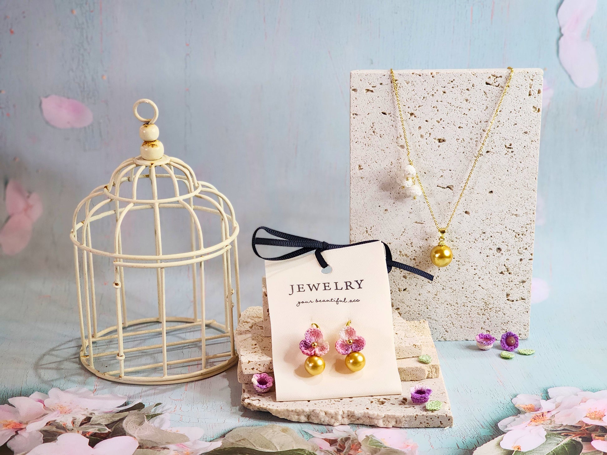 Collection of Dark gold South Sea pearl earrings and necklace with handcrafted micro‑crochet blossoms, on 18K gold-plated ear hooks and chain 