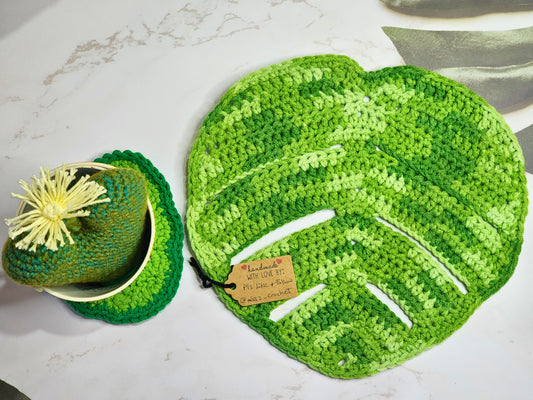 Large Monstera crocheted table centerpiece in varying shades of green