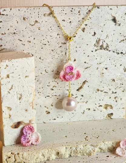 Close up of a Pink-White Orchid mIcro-crochet necklace with 12mm pink-purple Aurora grade natural freshwater pearl 