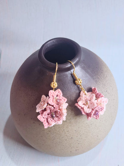 Handcrafted cluster of pink & mauve micro-crocheted star flower earrings. Lightweight and elegant design accented with Miyuki glass beads from Japan.