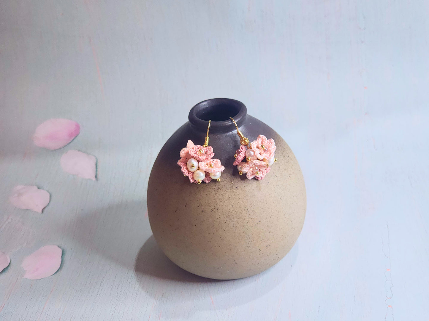 Handcrafted cluster of micro-crocheted star flower earrings. Accented with 4-5mm natural freshwater pearls. 