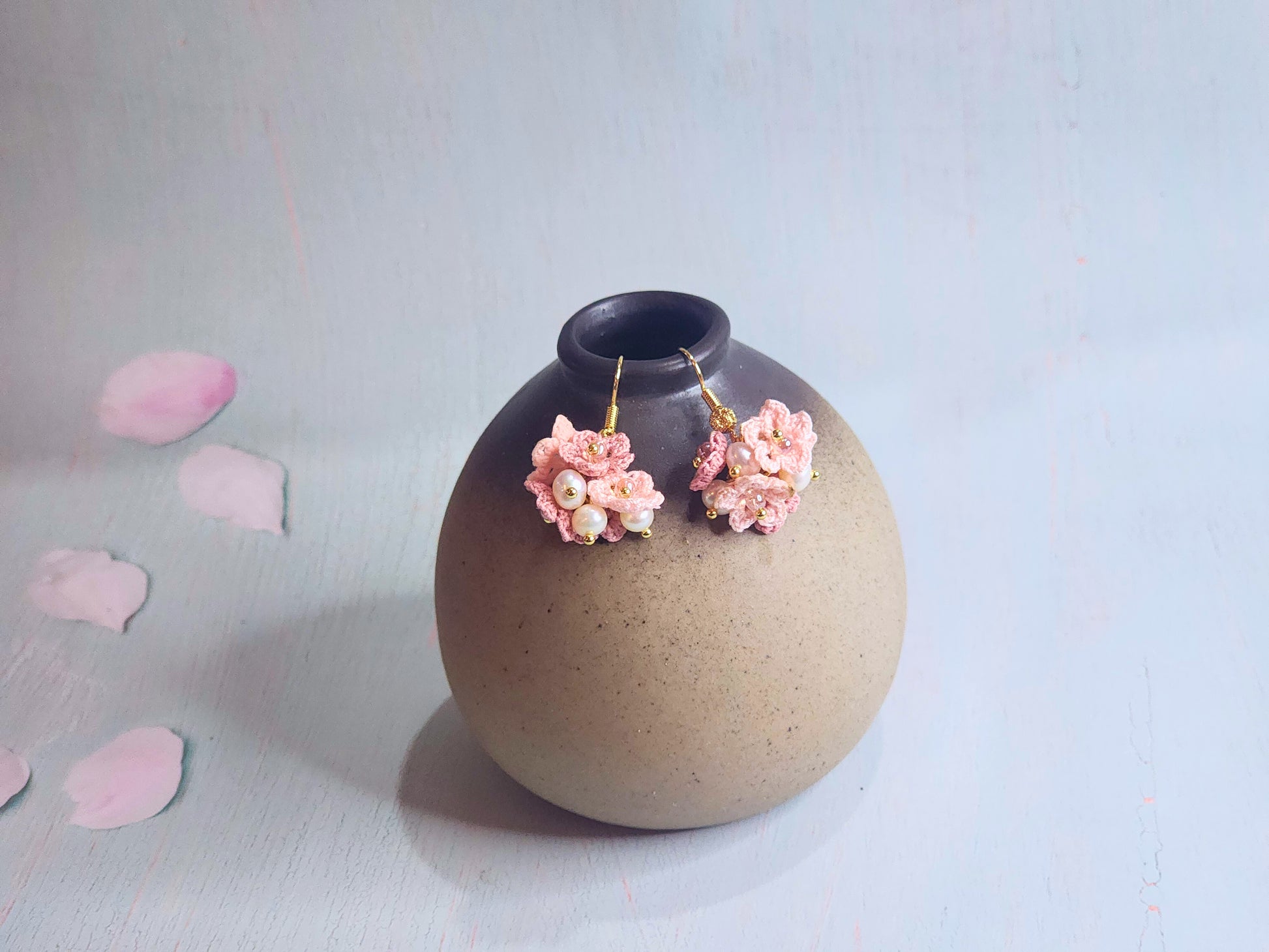 Handcrafted cluster of micro-crocheted star flower earrings. Accented with 4-5mm natural freshwater pearls. 