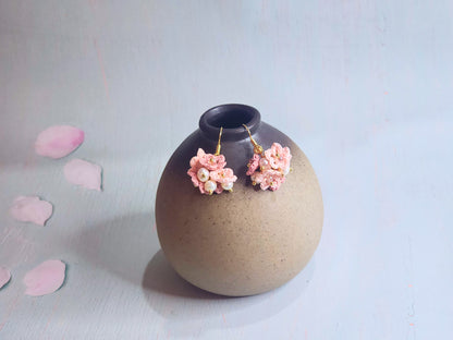 Handcrafted cluster of micro-crocheted star flower earrings. Accented with 4-5mm natural freshwater pearls. 