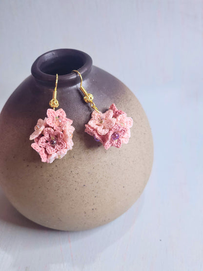 Handcrafted cluster of pink & mauve micro-crocheted star flower earrings. Lightweight and elegant design accented with Miyuki glass beads from Japan.
