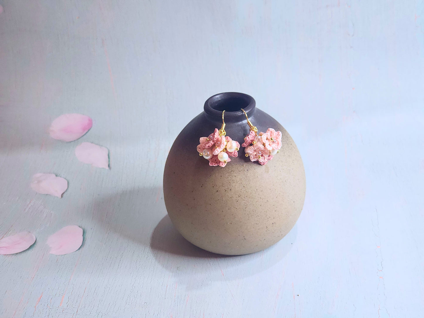 Handcrafted cluster of micro-crocheted star flower earrings. Accented with 4-5mm natural freshwater pearls. 