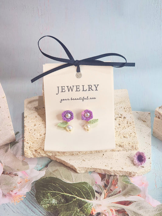 Handcrafted purple micro-crochet Lily of the Valley earrings, adorned witb 5-5.5mm freshwater pearls and 5-6mm Baroque pearls. 18K gold-plated studs. 