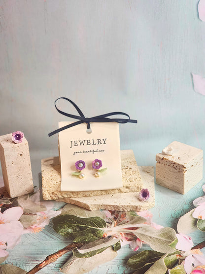 Handcrafted purple micro-crochet Lily of the Valley earrings, adorned witb 5-5.5mm freshwater pearls and 5-6mm Baroque pearls. 18K gold-plated studs. 