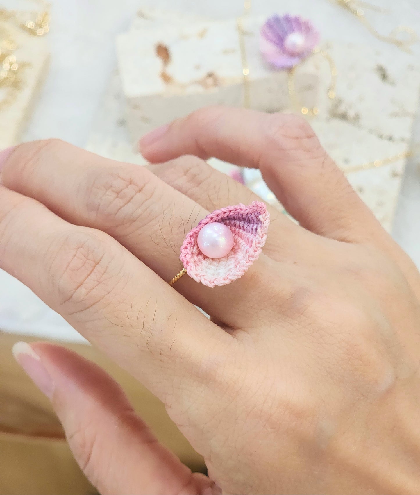 Handcrafted micro-crochet seashell ring with a flawless 6-7mm freshwater pink pearl on 14K gold-plated adjustable band