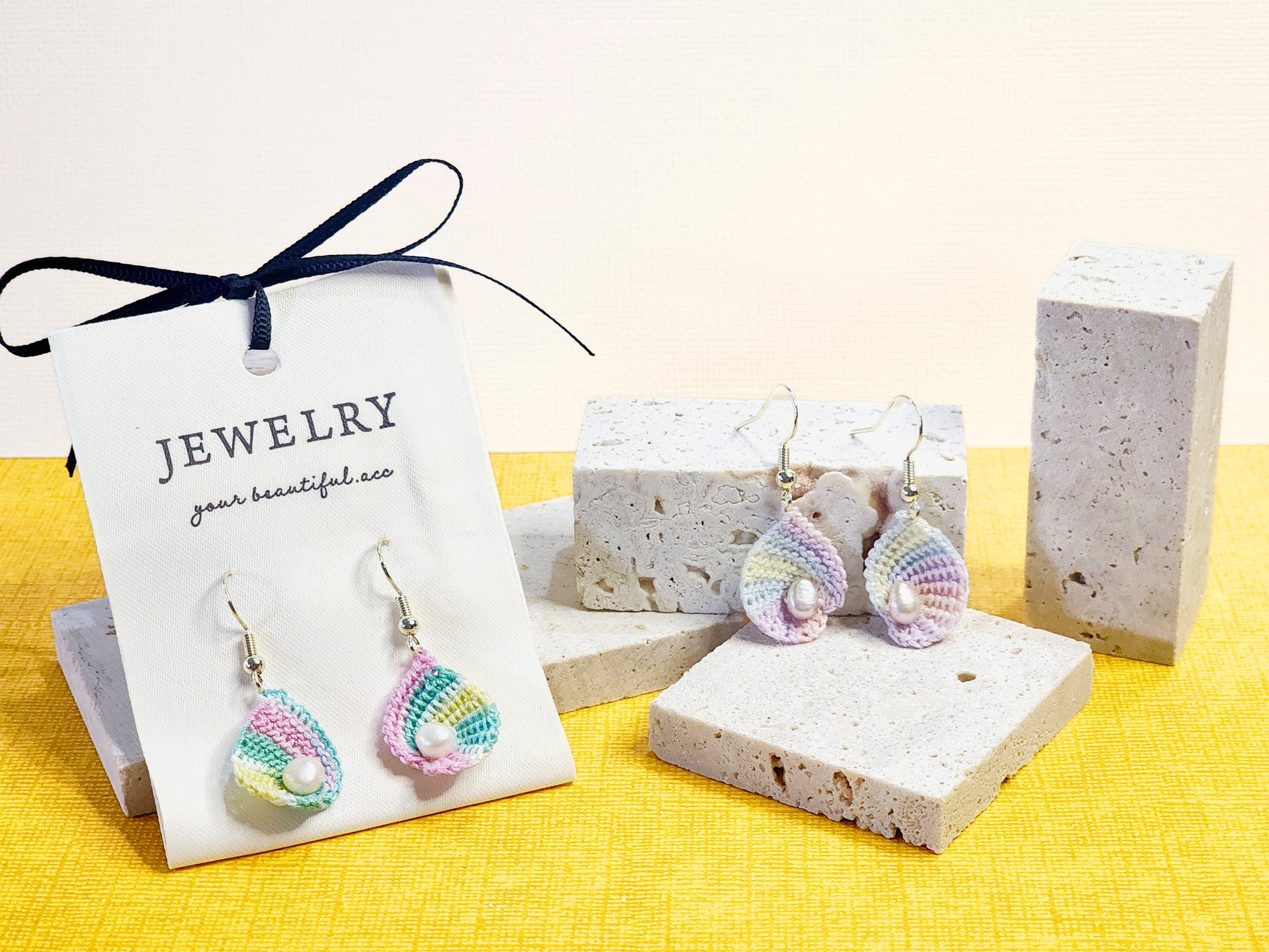 A pair of limited edition micro-crochet seashell with real baroque pearls earrings