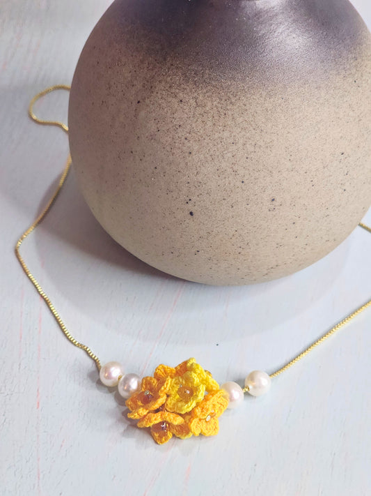 Handcrafted micro-crochet star flower cluster flanked by 6-7mm, nearly round, natural freshwater pearls. Accented with Miyuki glass beads.