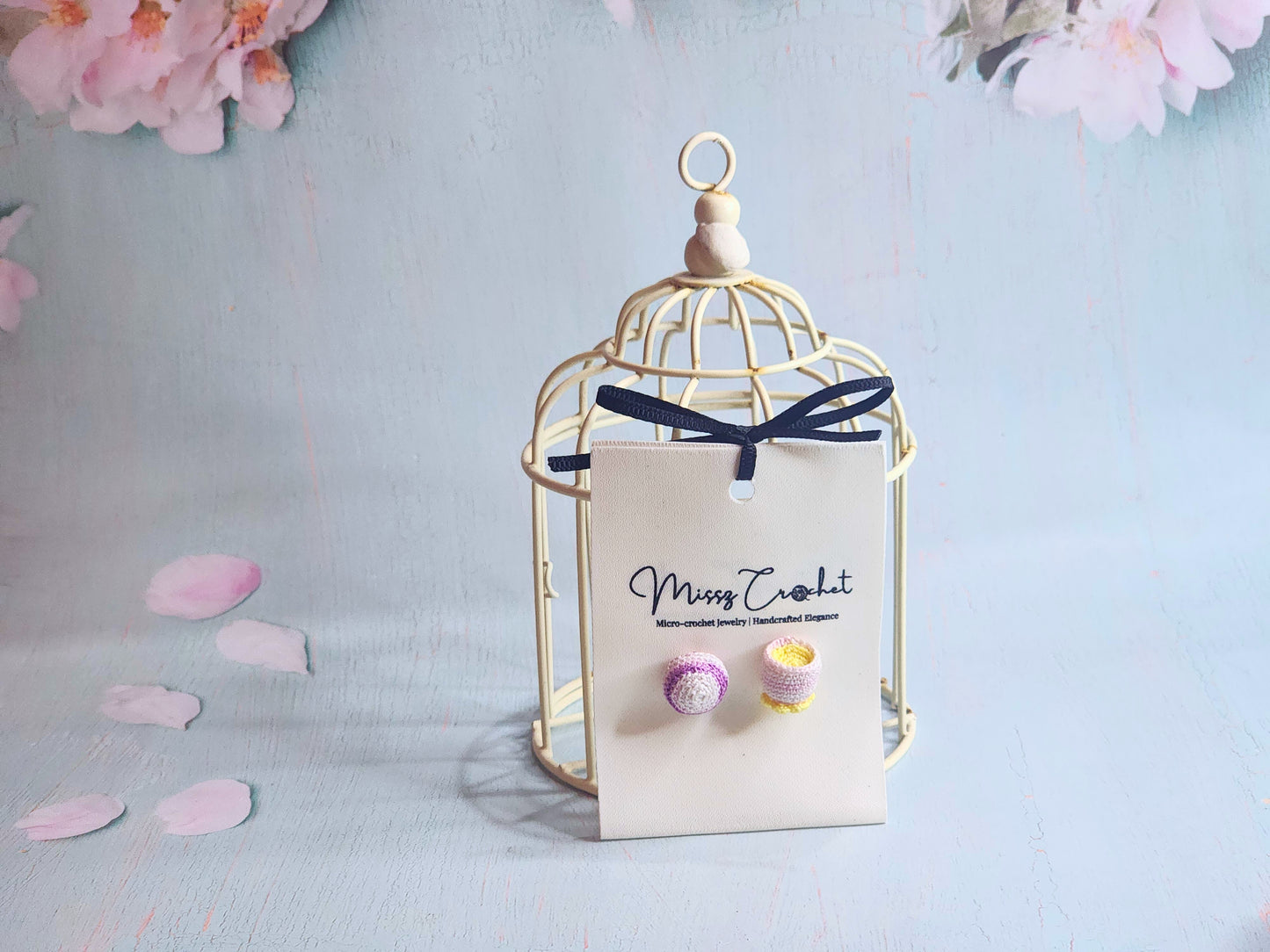 Handcrafted amigurumi earrings feature a micro-crochet taro pastry, and a teacup. Set with 18K gold-plated ear studs.