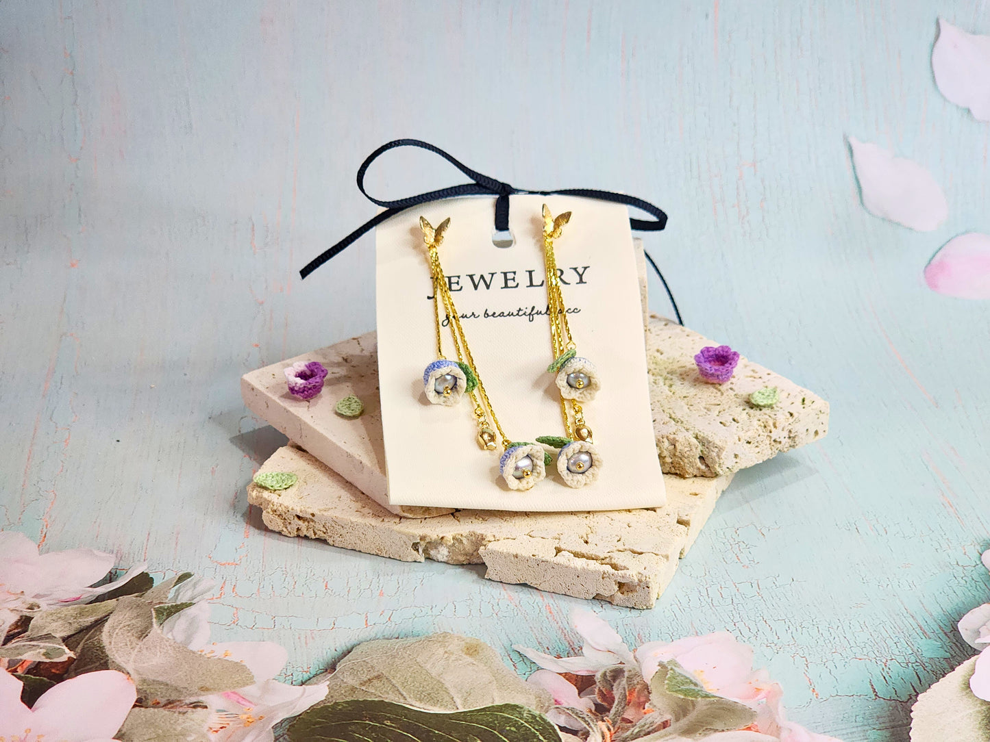 White-blue micro-crochet Lilies of the Valley with 4.5-5mm smoke grey freshwater pearls chandelier earrings, set with 18K gold-plated butterfly ear studs & findings. 
