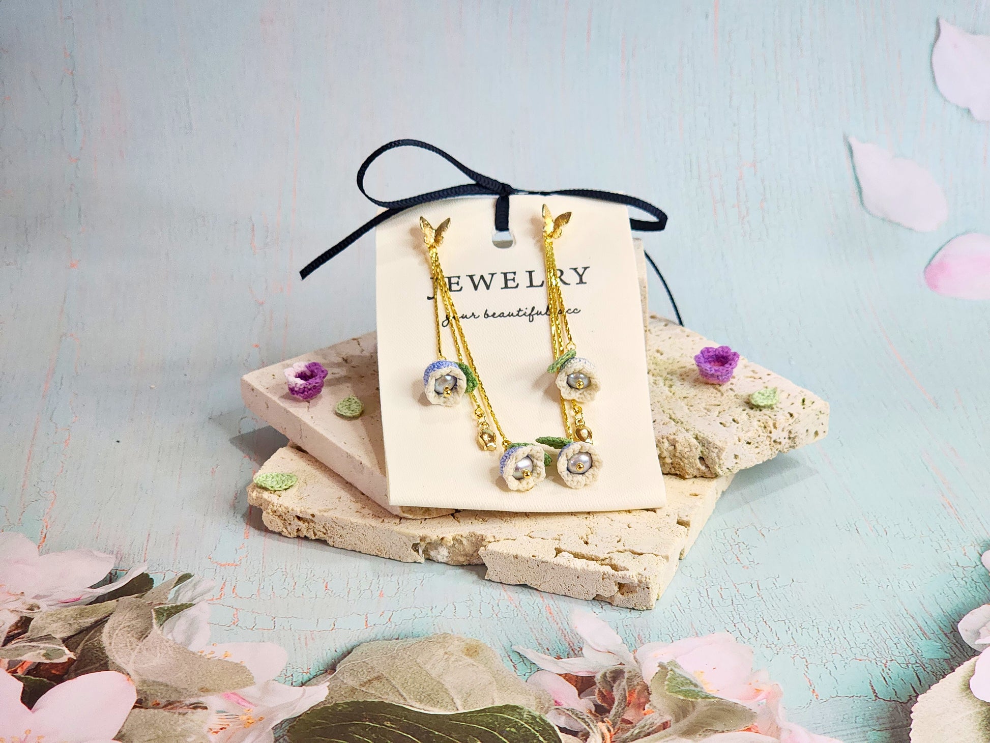 White-blue micro-crochet Lilies of the Valley with 4.5-5mm smoke grey freshwater pearls chandelier earrings, set with 18K gold-plated butterfly ear studs & findings. 