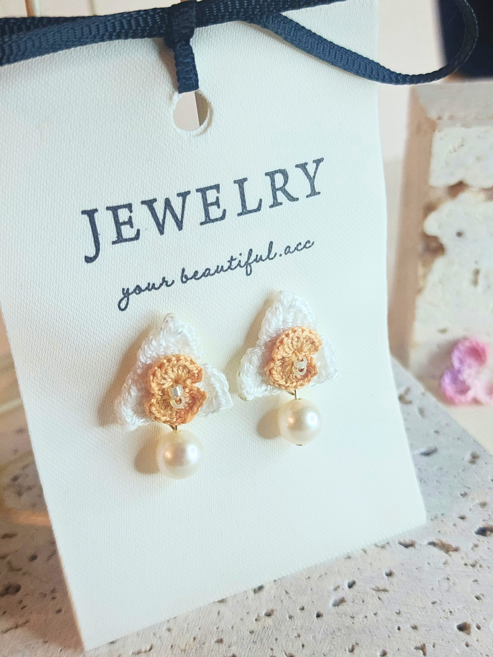 White Orchid micro-crochet earrings adorned with 7mm translucent natural freshwater pearl