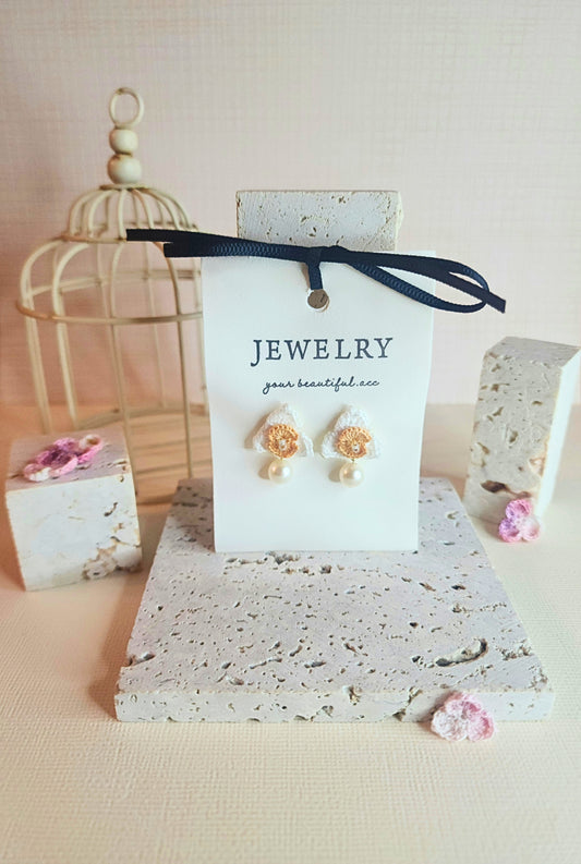 White Orchid micro-crochet earrings adorned with 7mm translucent natural freshwater pearl