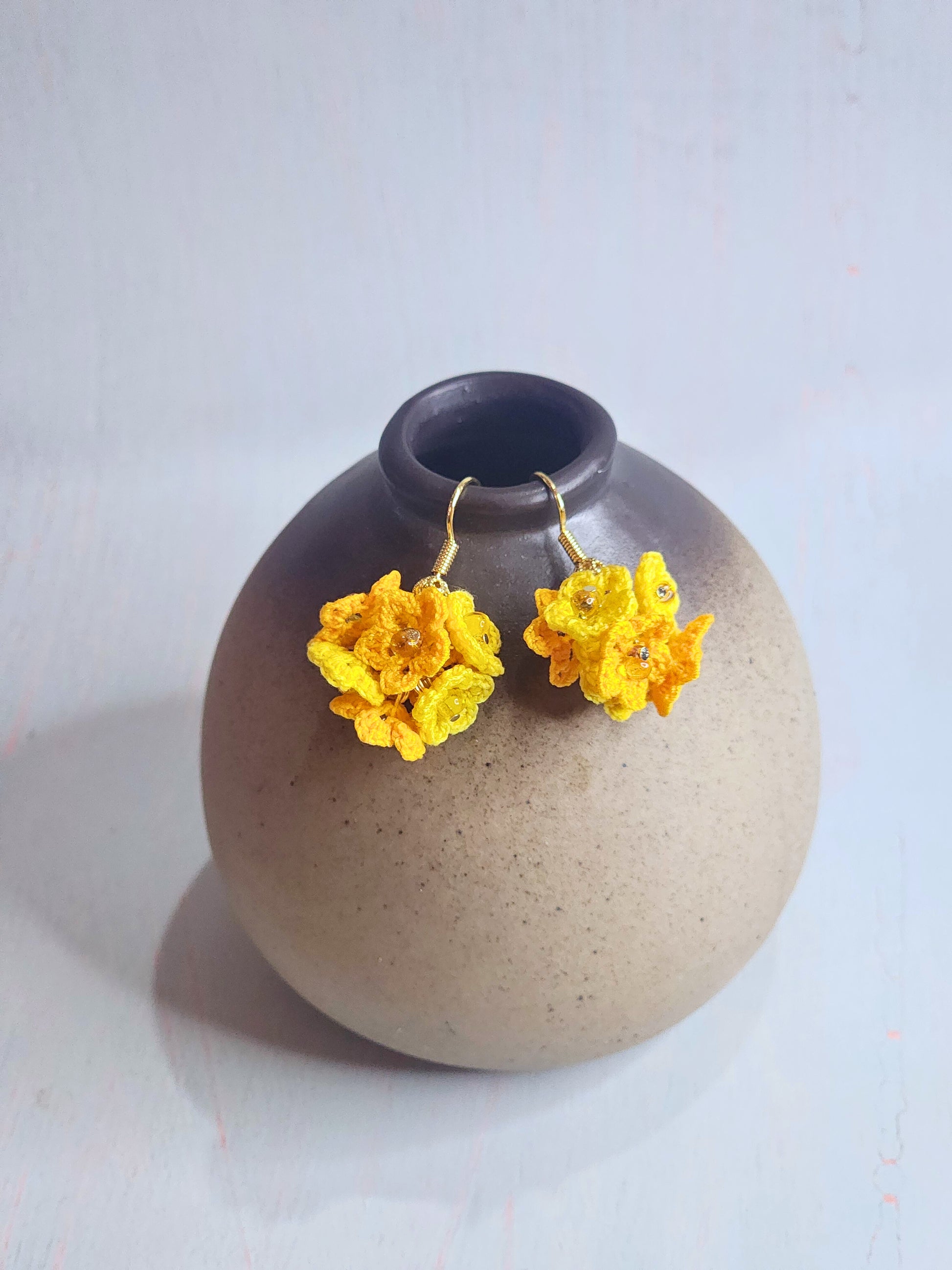 Handcrafted cluster of yellow & orange micro-crocheted star flower earrings. Lightweight and elegant design accented with Miyuki glass beads from Japan. 